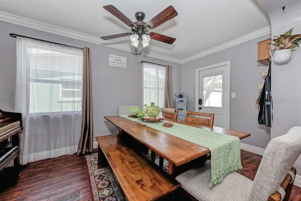 a dining room with furniture and window