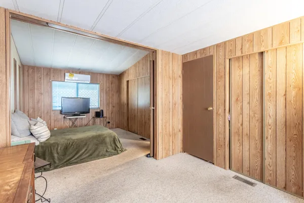 a bedroom with a bed and furniture