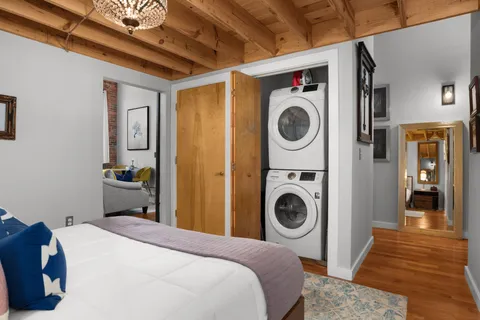 a bedroom with a bed and a view of bedroom