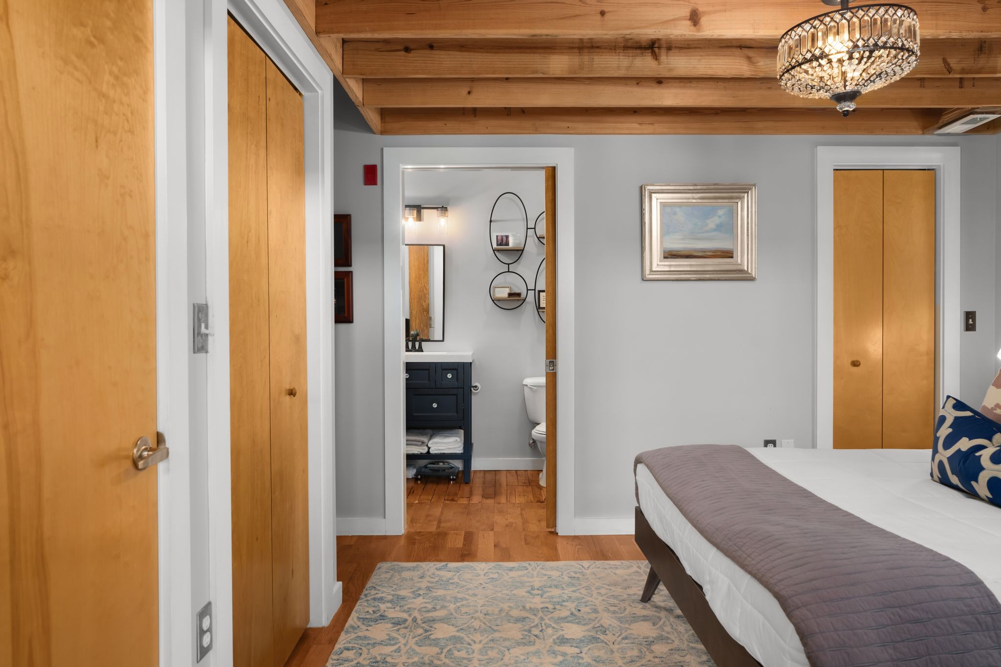 1350 Rosa L Parks Boulevard, Unit 463 Nashville, TN 37208 - Photo 19 of 44 a bedroom with a bed and a chandelier