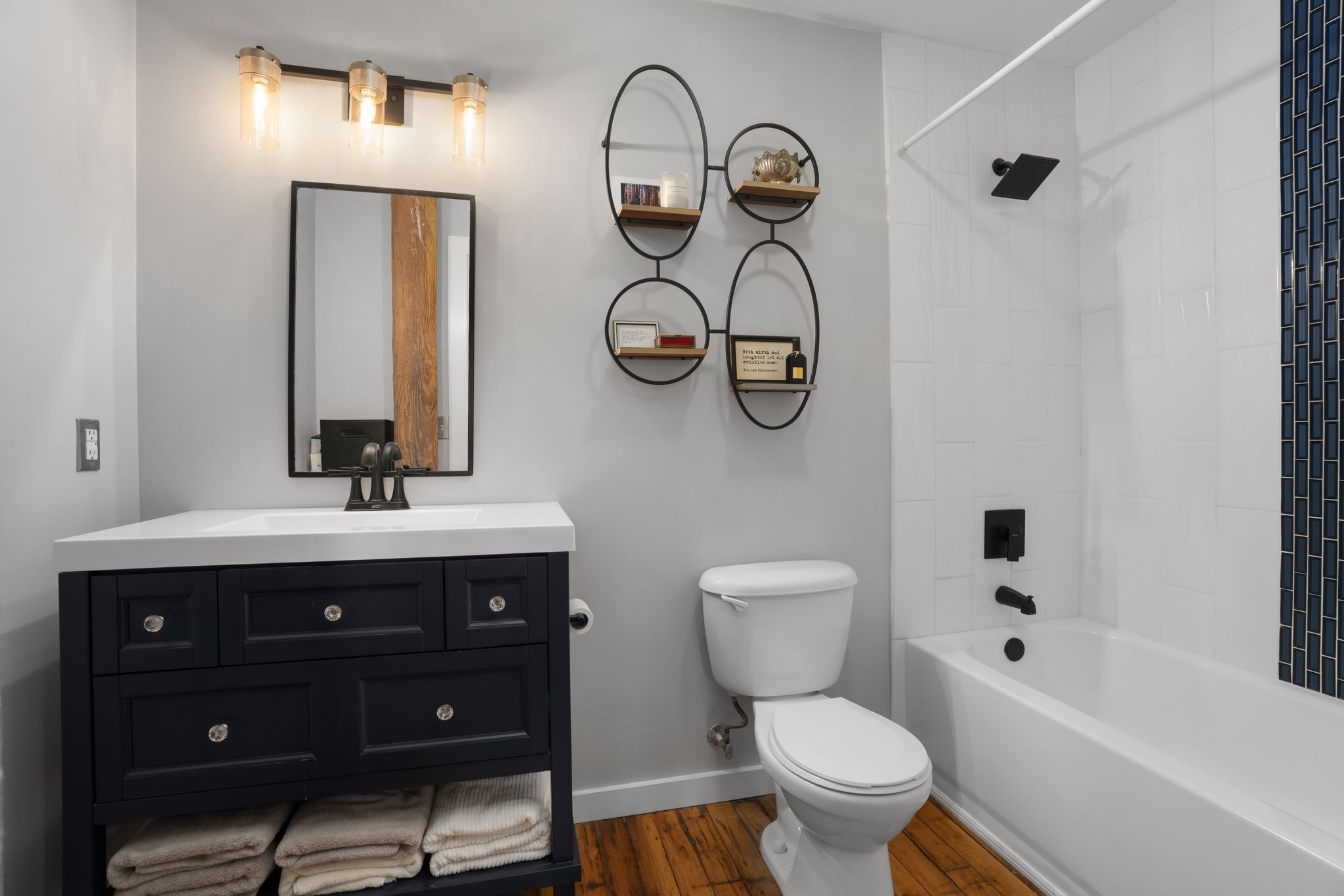 1350 Rosa L Parks Boulevard, Unit 463 Nashville, TN 37208 - Photo 20 of 44 a bathroom with a toilet sink and mirror