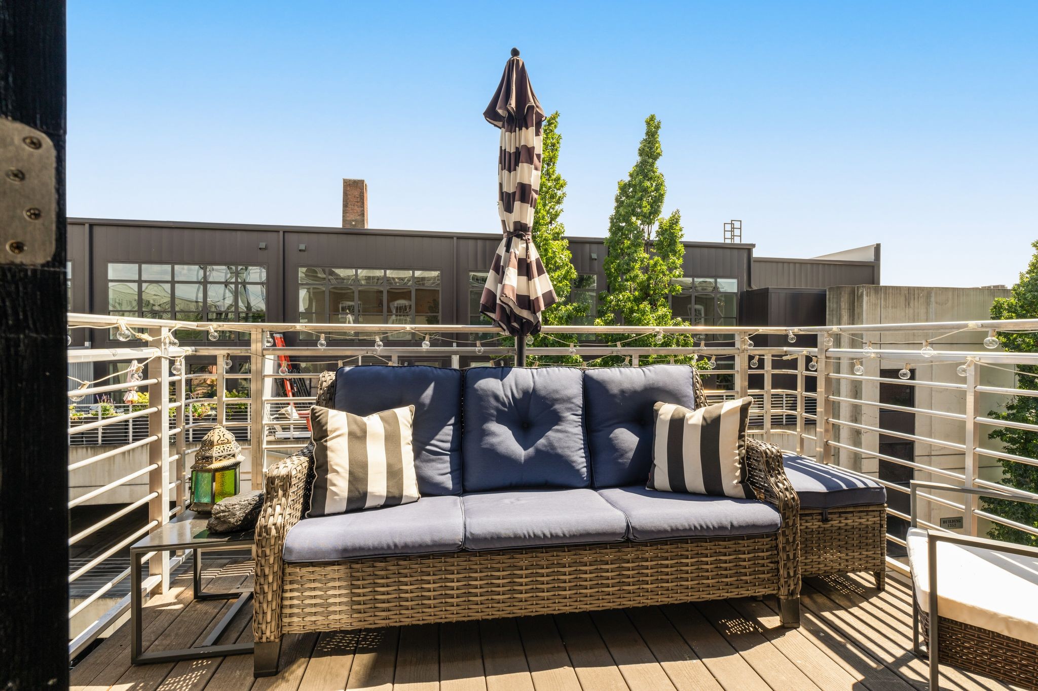 1350 Rosa L Parks Boulevard, Unit 463 Nashville, TN 37208 - Photo 23 of 44 a roof deck view with couches and potted plants
