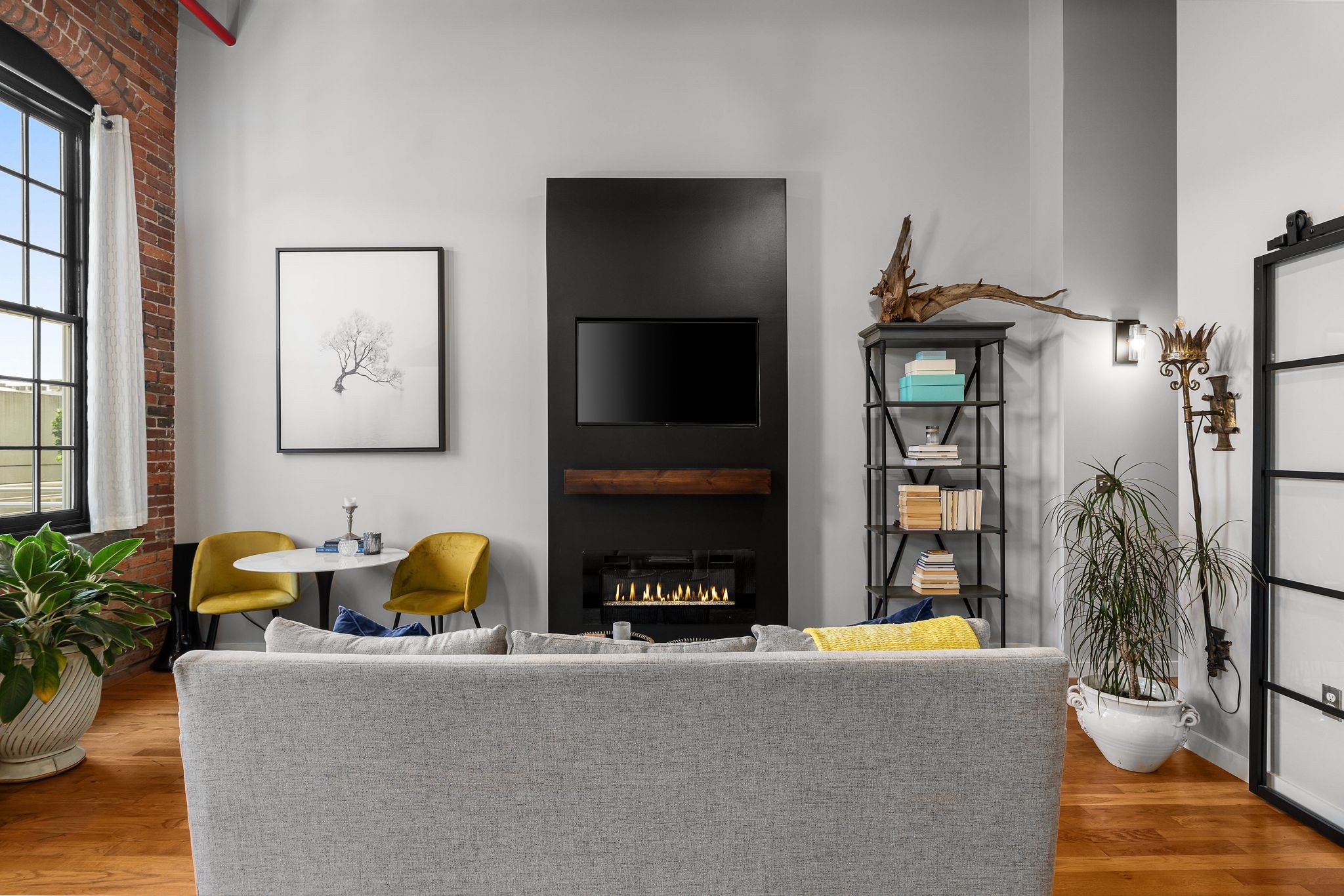 1350 Rosa L Parks Boulevard, Unit 463 Nashville, TN 37208 - Photo 6 of 44 a living room with fireplace furniture and a flat screen tv