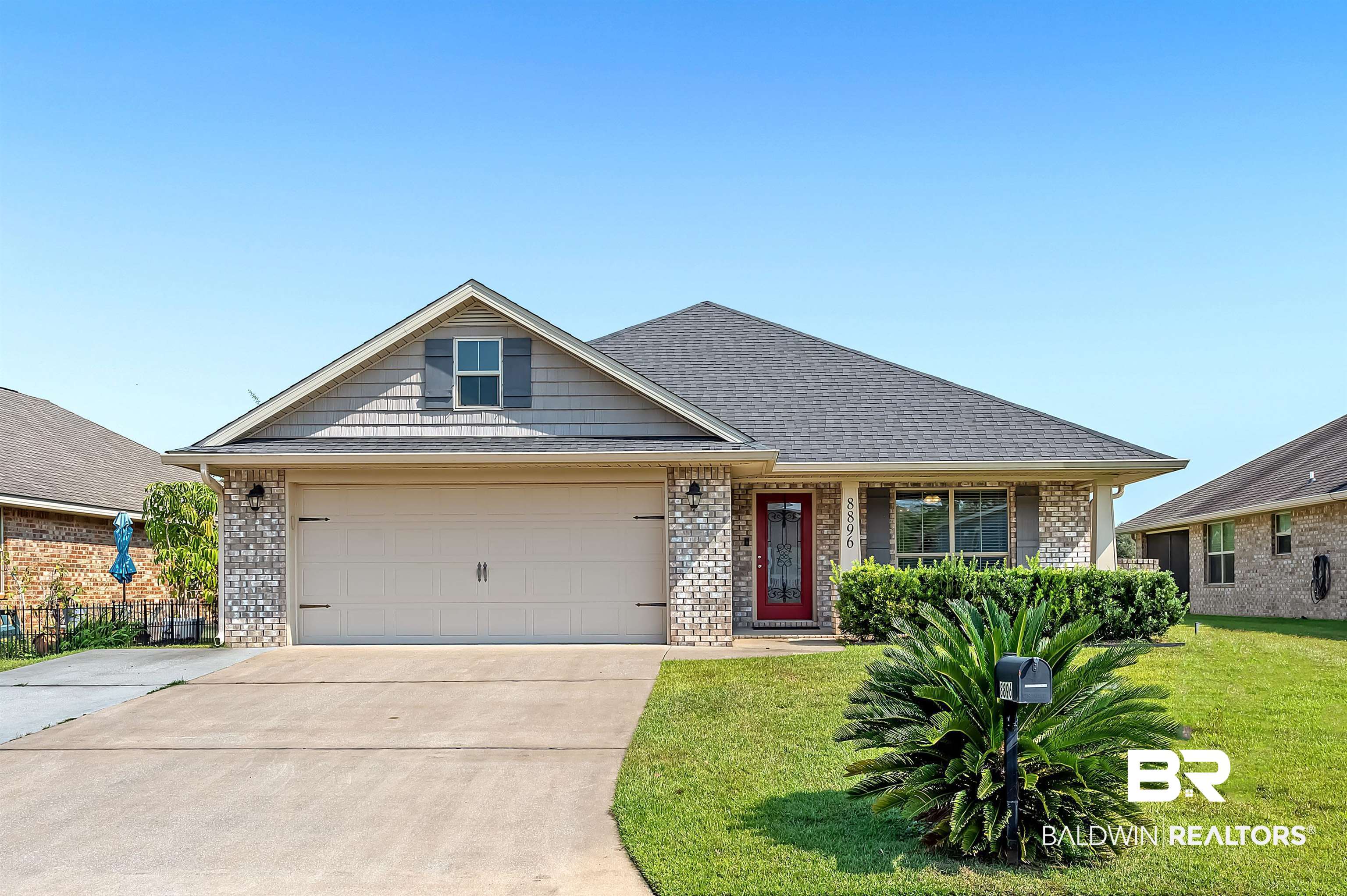 8896 Allay Lane Foley, AL 36535 - Photo 1 of 57 View of front of house featuring a front lawn and a garage