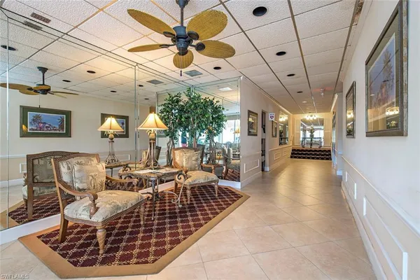 a living room with lots of furniture and a chandelier