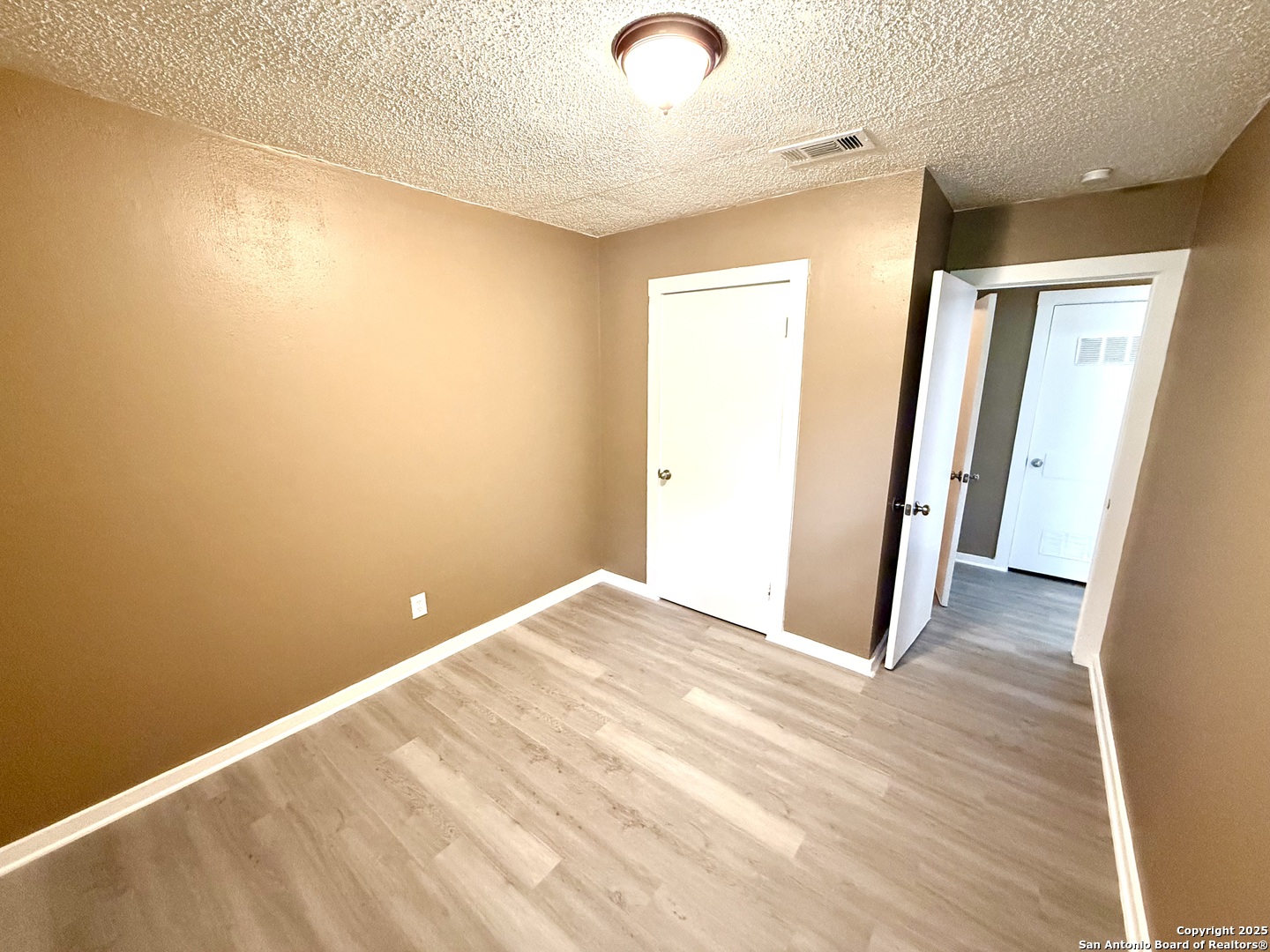 1827 East Highland Boulevard San Antonio, TX 78210 - Photo 13 of 17 a view of a room with wooden floor