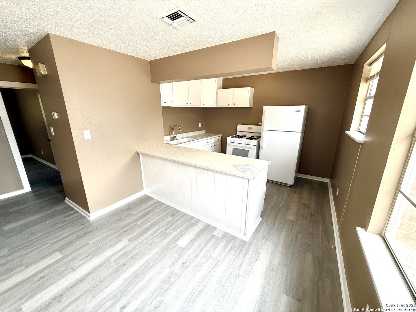 1827 East Highland Boulevard San Antonio, TX 78210 - Photo 5 of 17 a view of living room with furniture and wooden floor