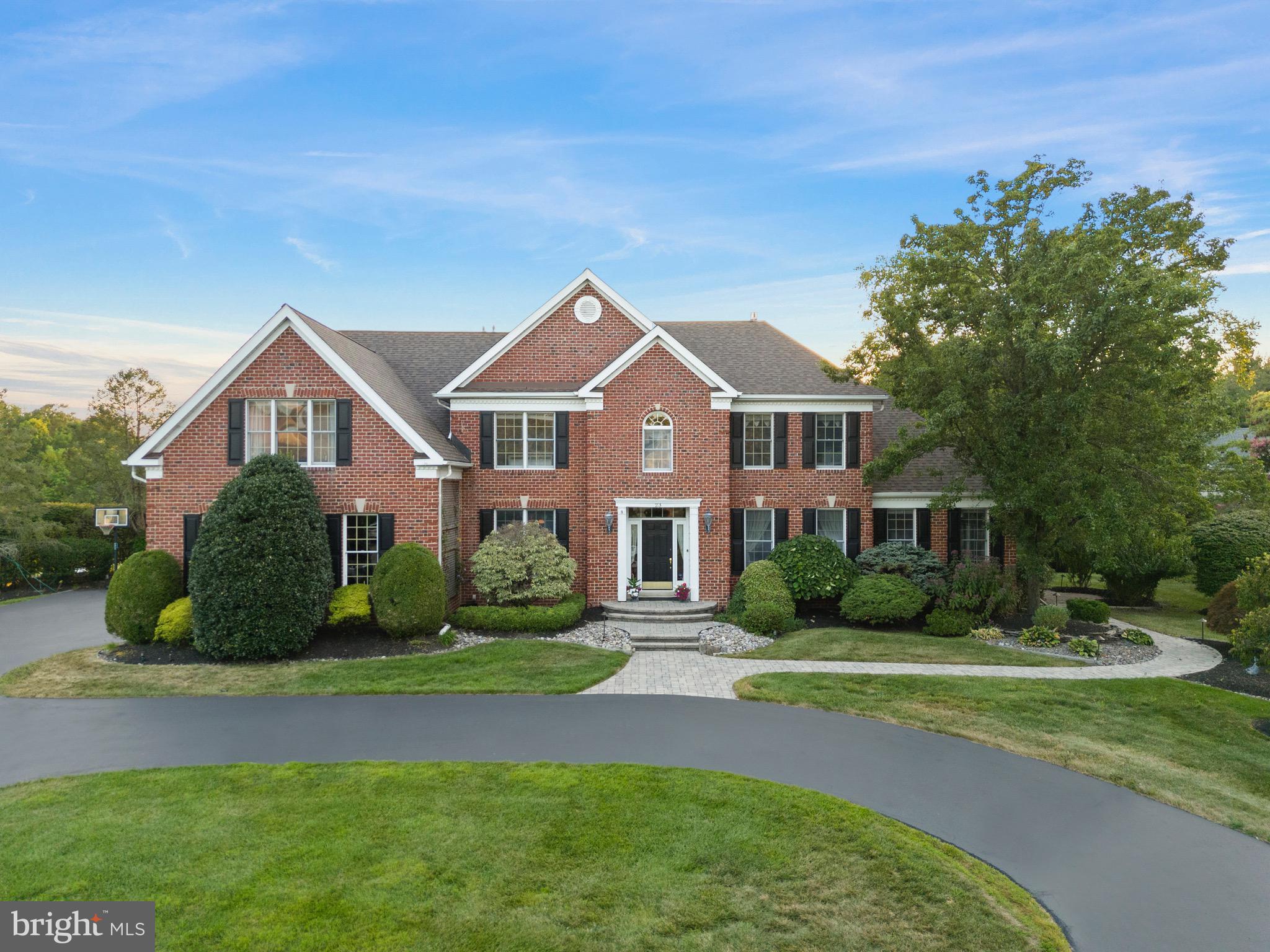 23 Apple Orchard Road Moorestown, NJ 08057 - Photo 1 of 72 a front view of a house with a yard