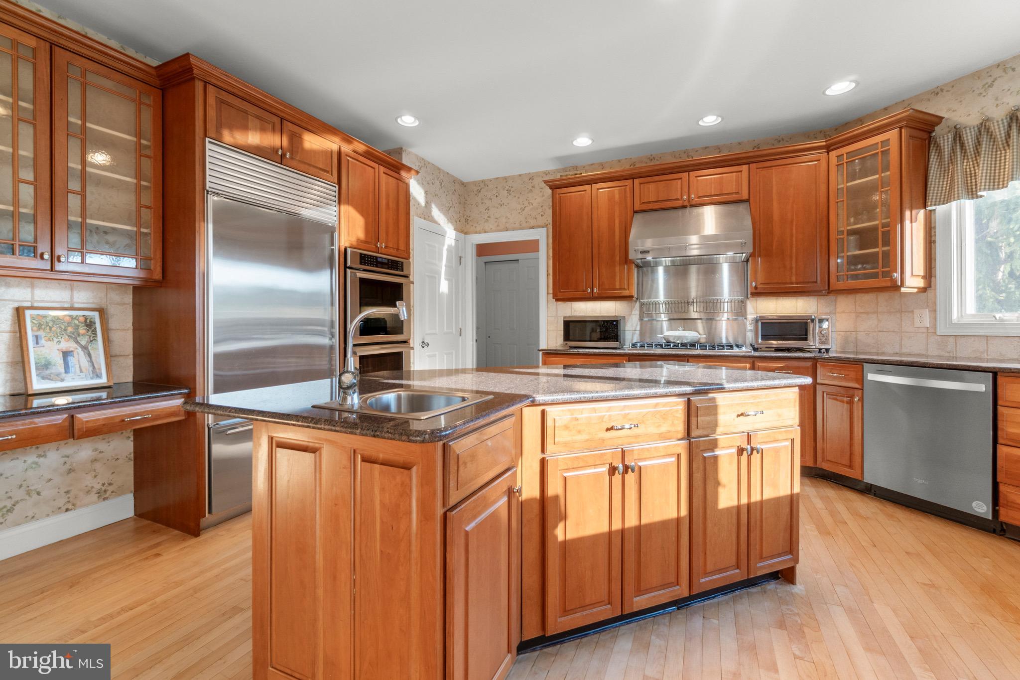 23 Apple Orchard Road Moorestown, NJ 08057 - Photo 13 of 72 a kitchen with stainless steel appliances granite countertop a stove a sink and a refrigerator