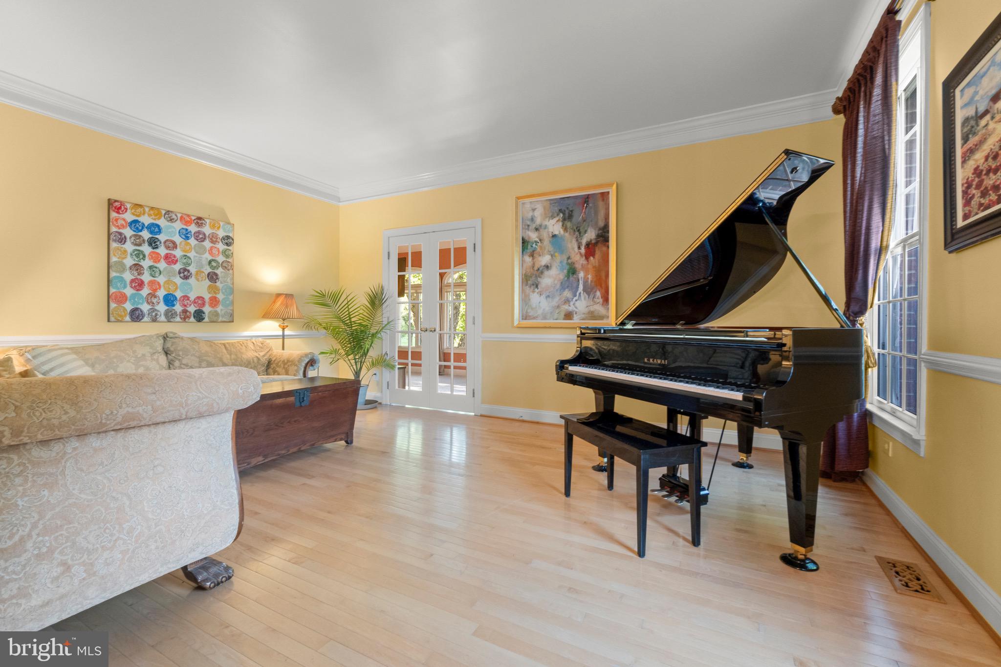 23 Apple Orchard Road Moorestown, NJ 08057 - Photo 23 of 72 a living room with furniture a piano and a potted plant