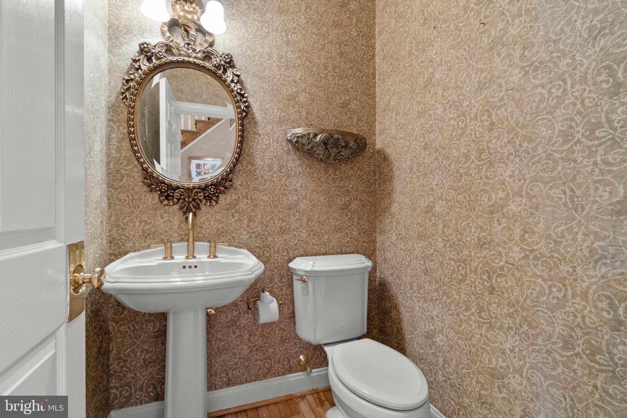 23 Apple Orchard Road Moorestown, NJ 08057 - Photo 25 of 72 a bathroom with a toilet sink and mirror