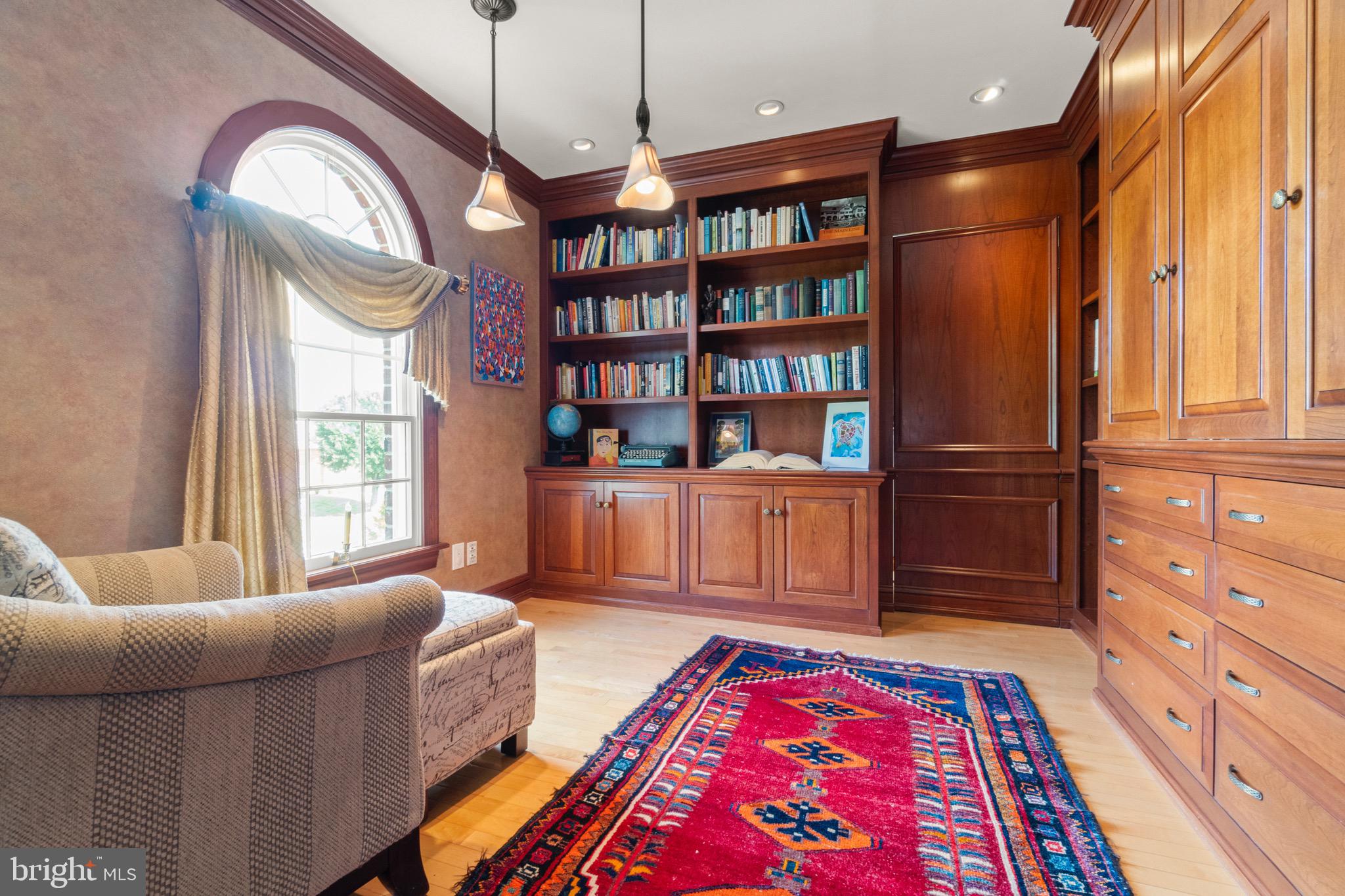 23 Apple Orchard Road Moorestown, NJ 08057 - Photo 33 of 72 a living room with furniture and a book shelf
