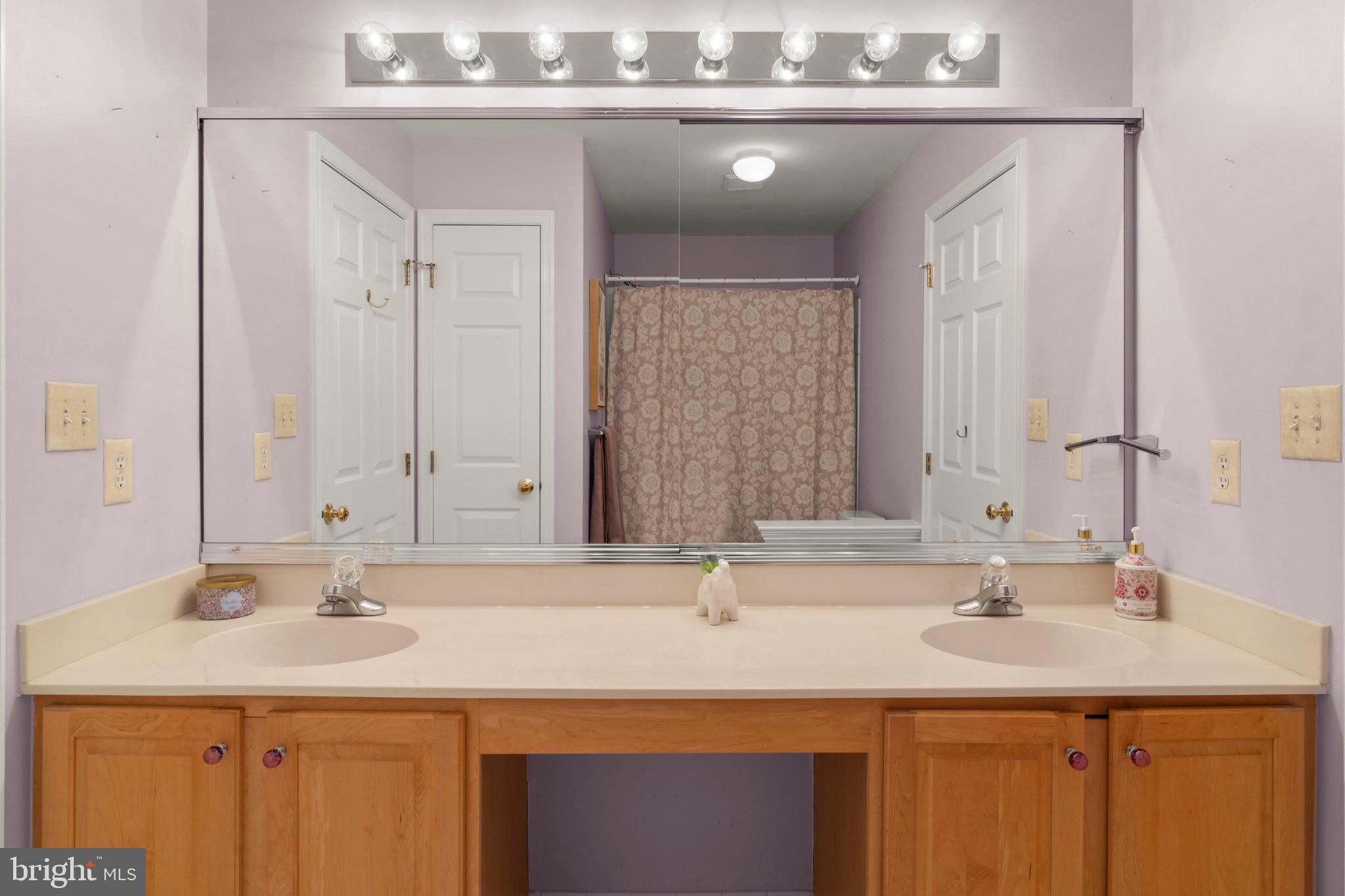 23 Apple Orchard Road Moorestown, NJ 08057 - Photo 48 of 72 a bathroom with a sink vanity and a mirror