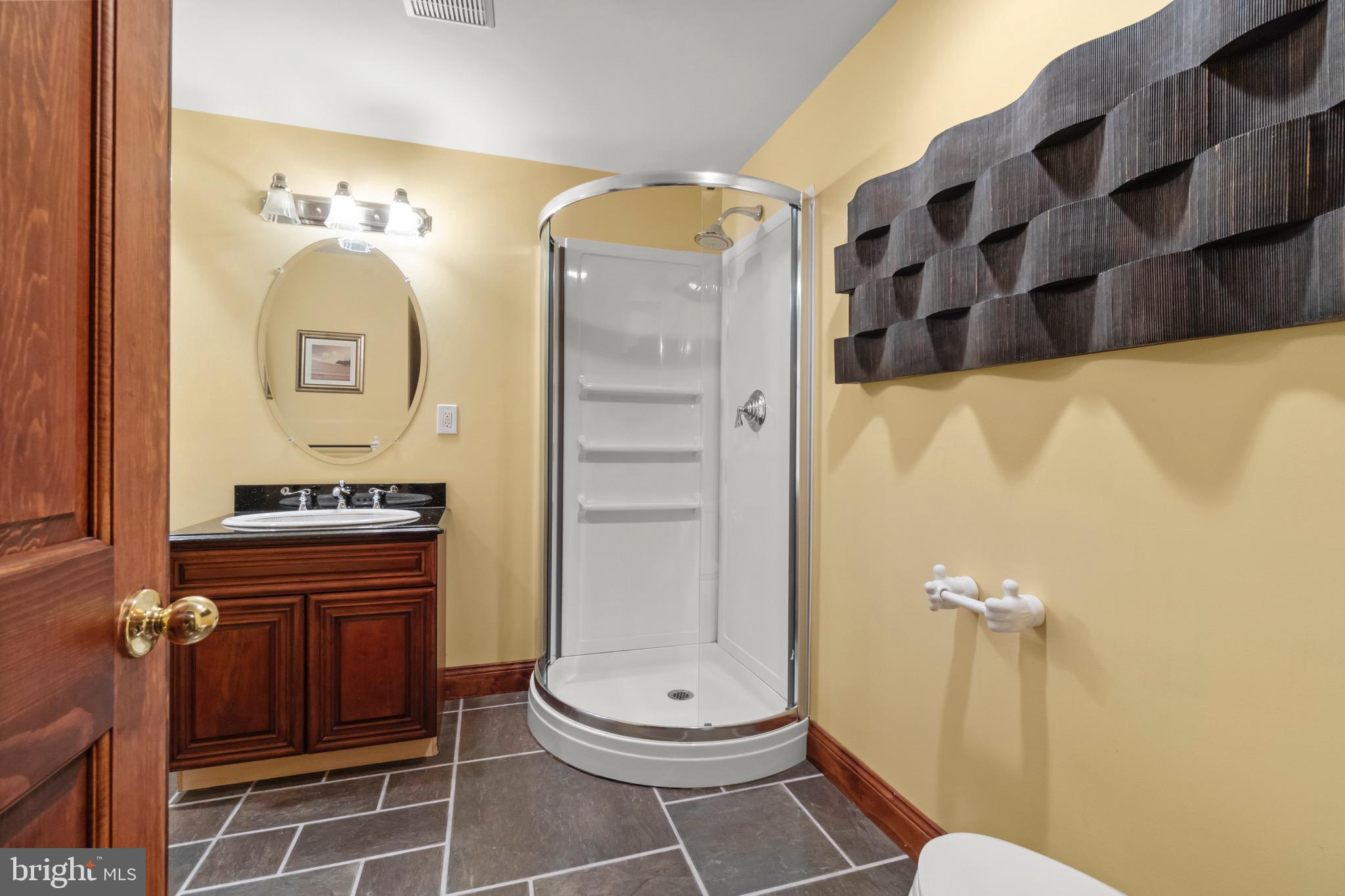 23 Apple Orchard Road Moorestown, NJ 08057 - Photo 54 of 72 a bathroom with a toilet sink and mirror