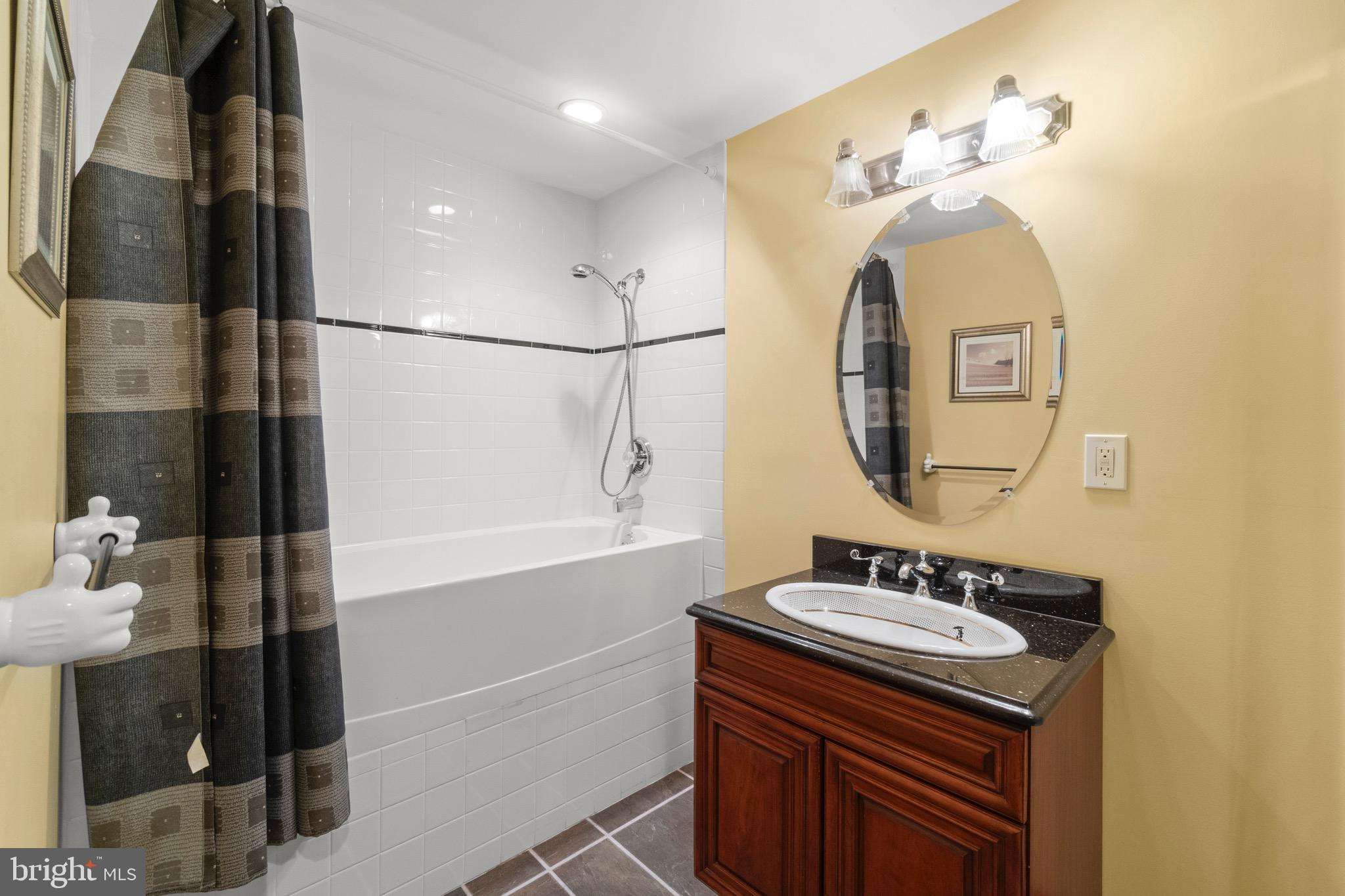 23 Apple Orchard Road Moorestown, NJ 08057 - Photo 55 of 72 a bathroom with a sink a mirror and a shower