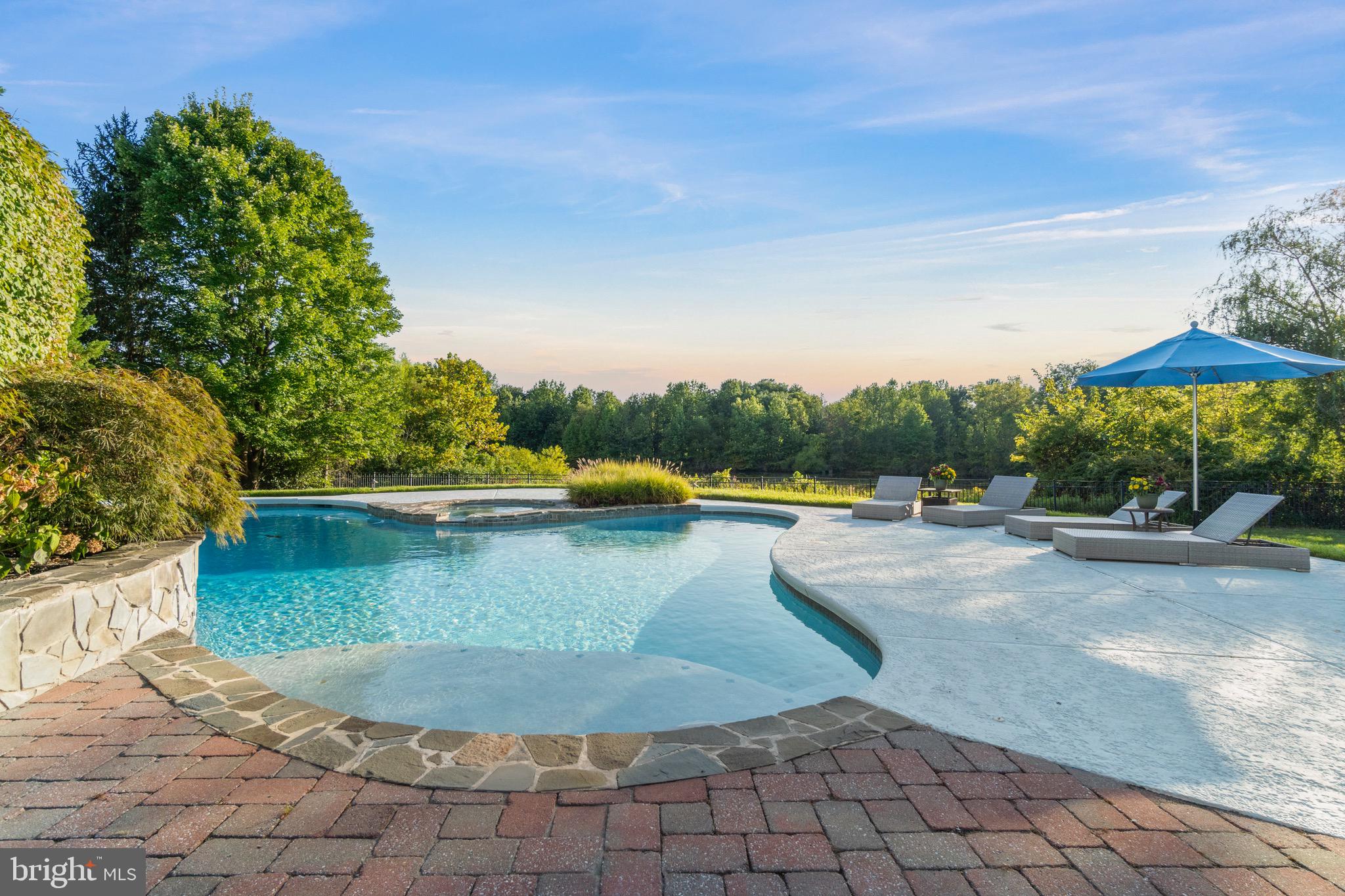 23 Apple Orchard Road Moorestown, NJ 08057 - Photo 60 of 72 a view of a swimming pool with a yard and plants
