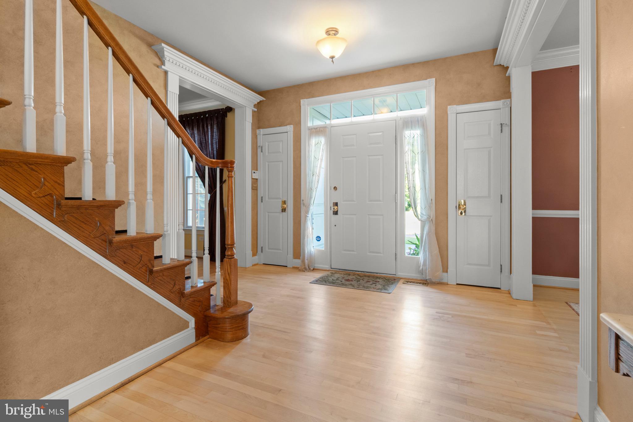 23 Apple Orchard Road Moorestown, NJ 08057 - Photo 6 of 72 a view of an entryway with wooden floor and door