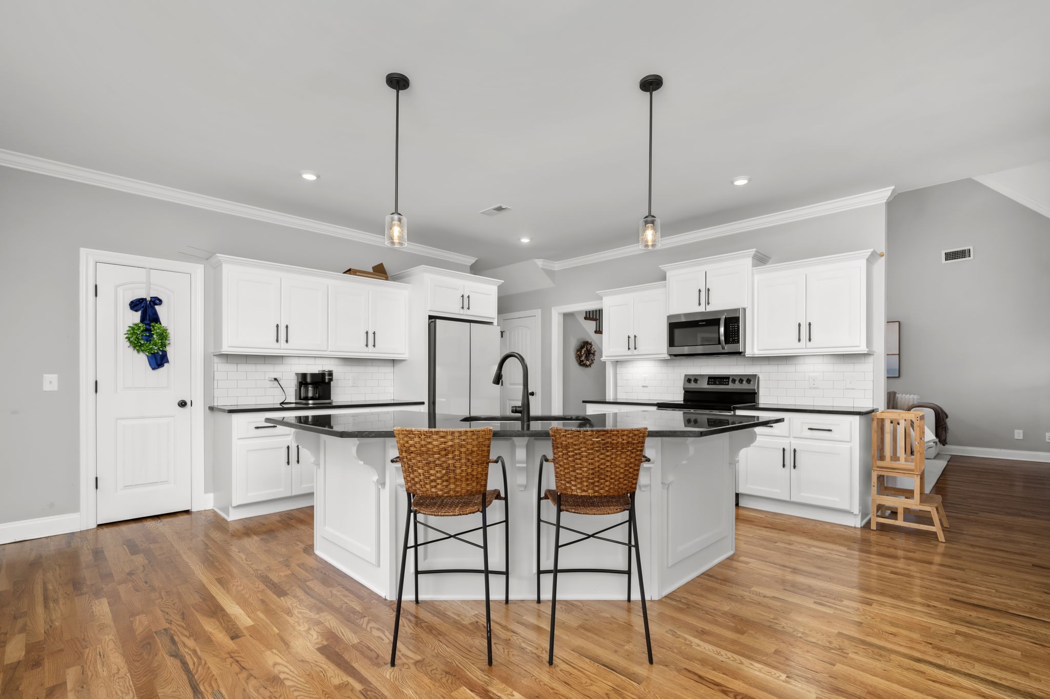 810 Walnut Grove Road Christiana, TN 37037 - Photo 4 of 48 a kitchen with white cabinets and white appliances