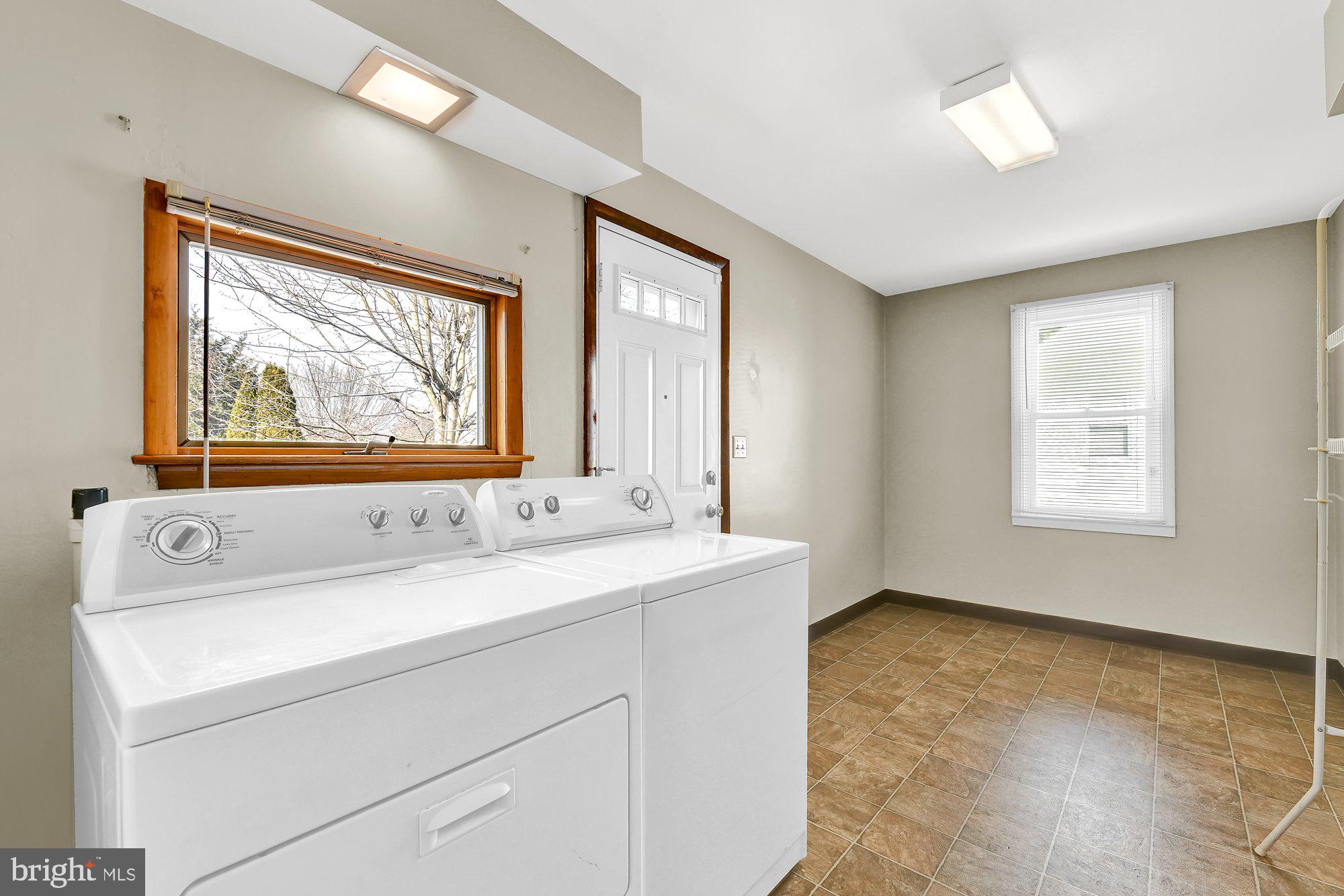 4559 Ridge Road Baltimore, MD 21236 - Photo 12 of 34 Laundry room off kitchen with exit to backyard