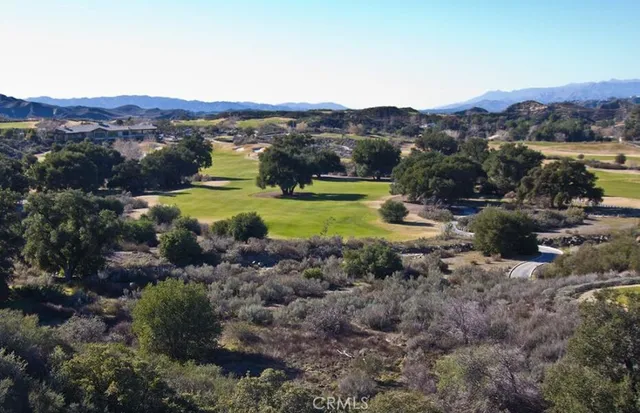 a view of a town with mountains in the background