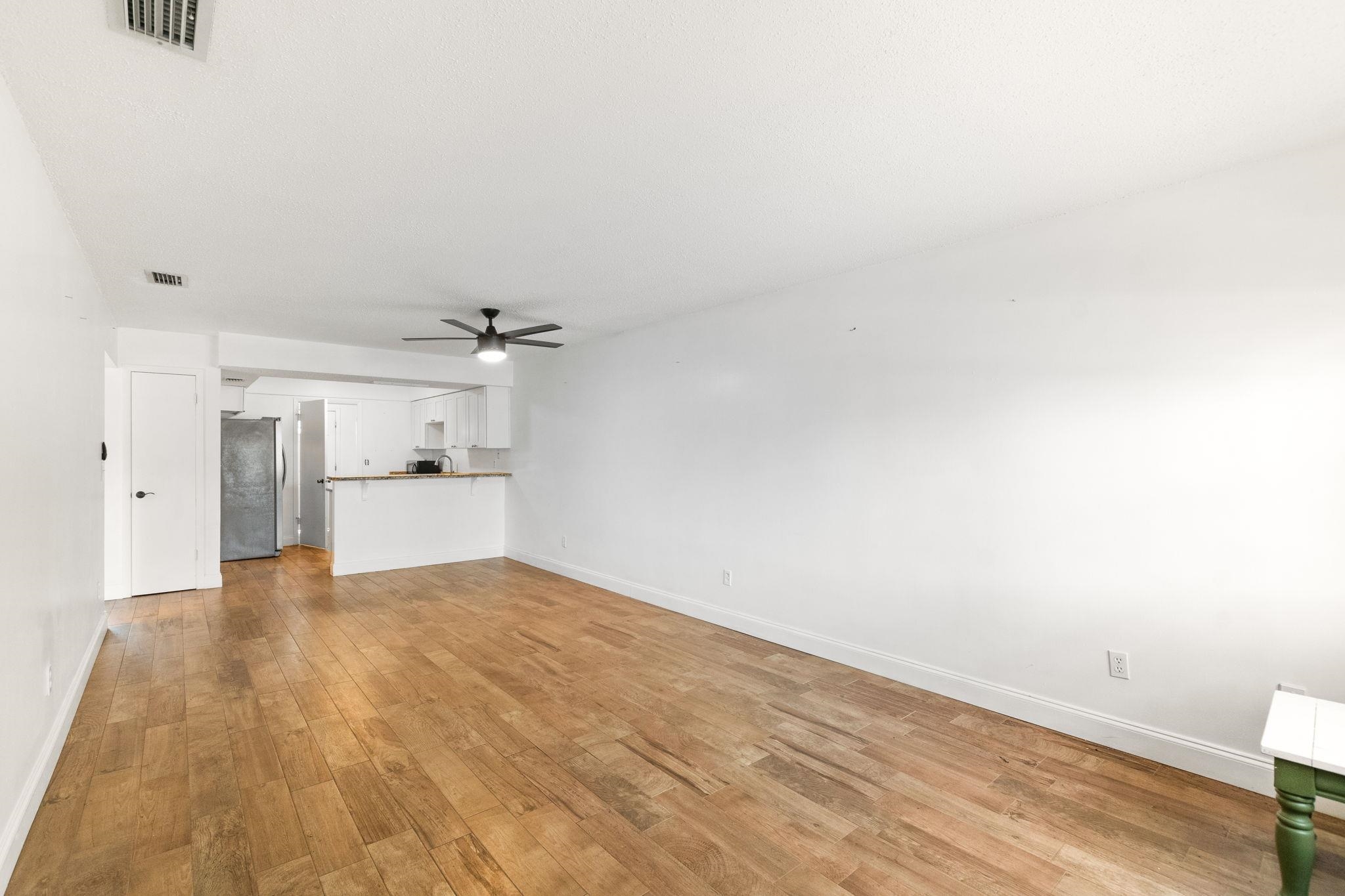 129 Rio Del Mar Street, Unit B St. Augustine, FL 32080 - Photo 8 of 20 a view of empty room with wooden floor