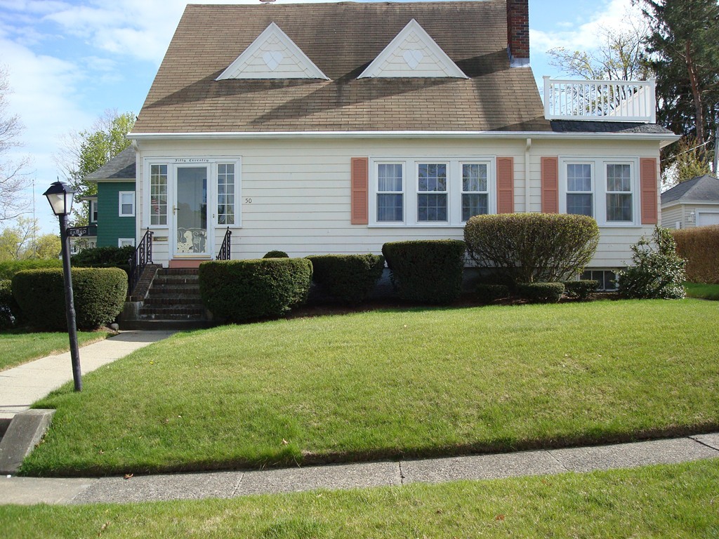50 Coventry Road Worcester, MA 01606 - Photo 2 of 22 a front view of a house with a yard