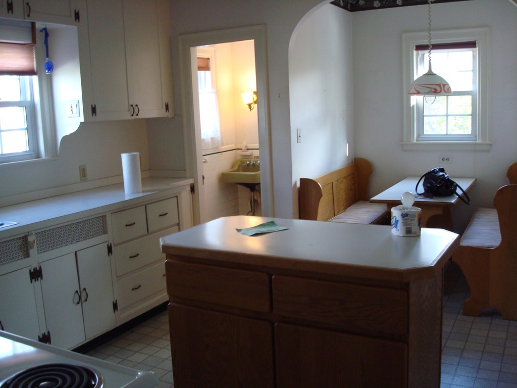50 Coventry Road Worcester, MA 01606 - Photo 8 of 22 a kitchen with cabinets appliances and a window
