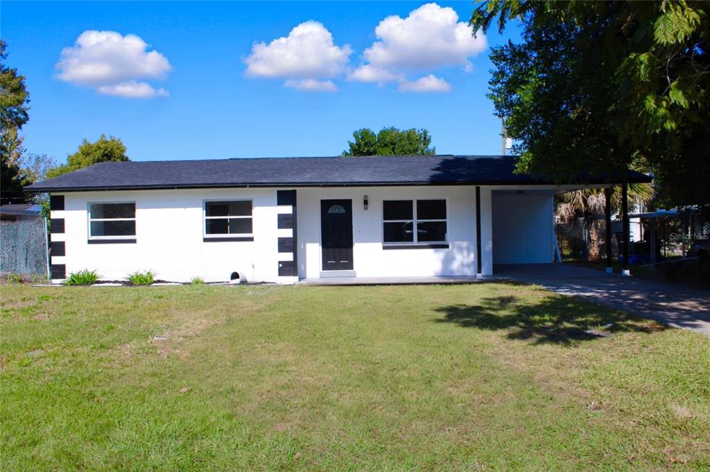 2329 West Doris Street Kissimmee, FL 34741 - Photo 1 of 1 a front view of house with yard