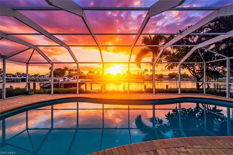 a view of a swimming pool with a lake view