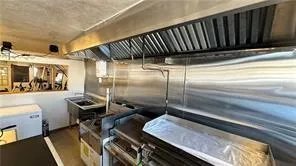 a view of a living room kitchen and a window