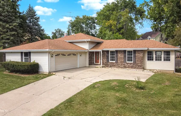 a front view of a house with yard porch and furniture