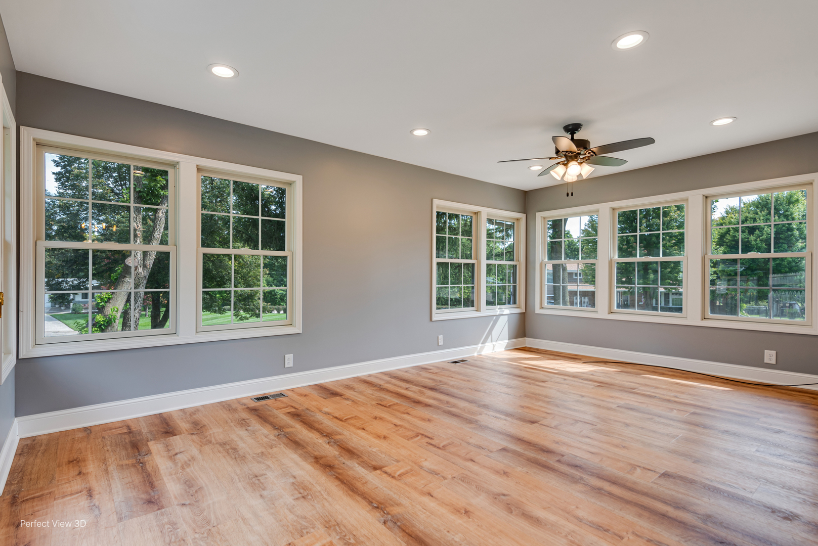 102 Hickory Lane Morris, IL 60450 - Photo 12 of 33 a view of an empty room with a window and wooden floor