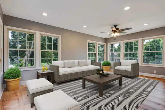 a bathroom with a granite countertop toilet sink and mirror