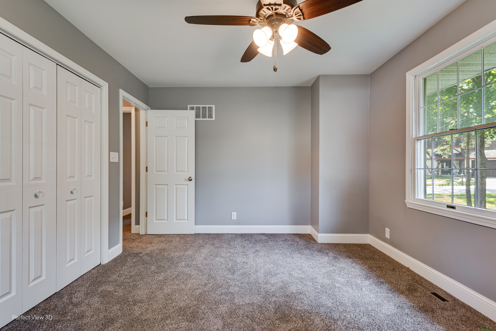 102 Hickory Lane Morris, IL 60450 - Photo 25 of 33 an empty room with windows and chandelier fan