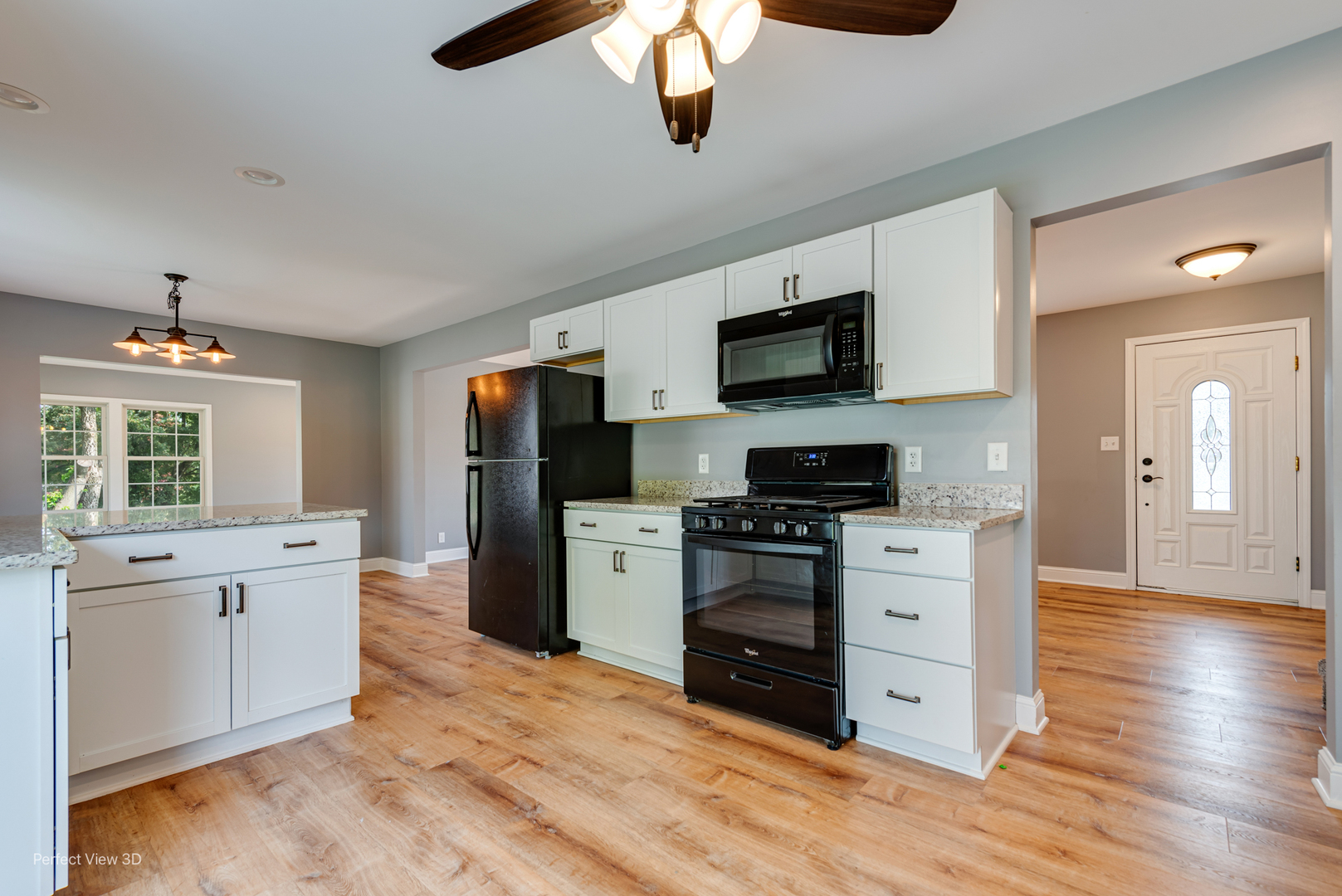 102 Hickory Lane Morris, IL 60450 - Photo 7 of 33 a kitchen with stainless steel appliances kitchen island granite countertop a stove top oven a sink dishwasher and a refrigerator with wooden floor