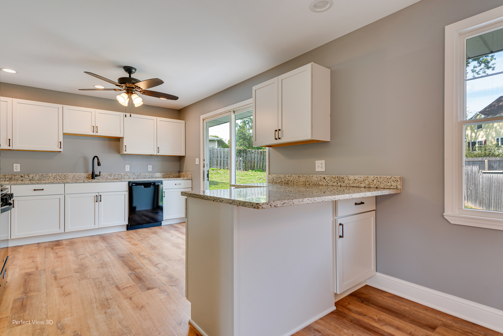 102 Hickory Lane Morris, IL 60450 - Photo 8 of 33 a kitchen with granite countertop a sink cabinets stainless steel appliances and a window