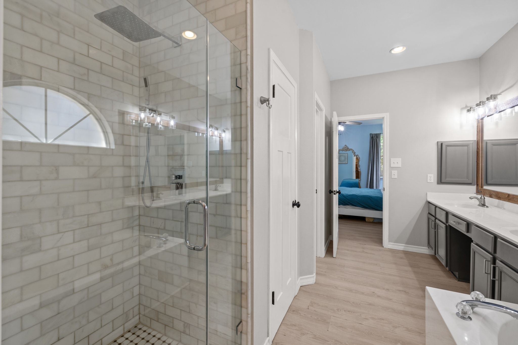 208 Sailors Run Lakeway, TX 78734 - Photo 15 of 40 The primary bathroom also incorporates a large walk-in shower and soaking tub for relaxation.