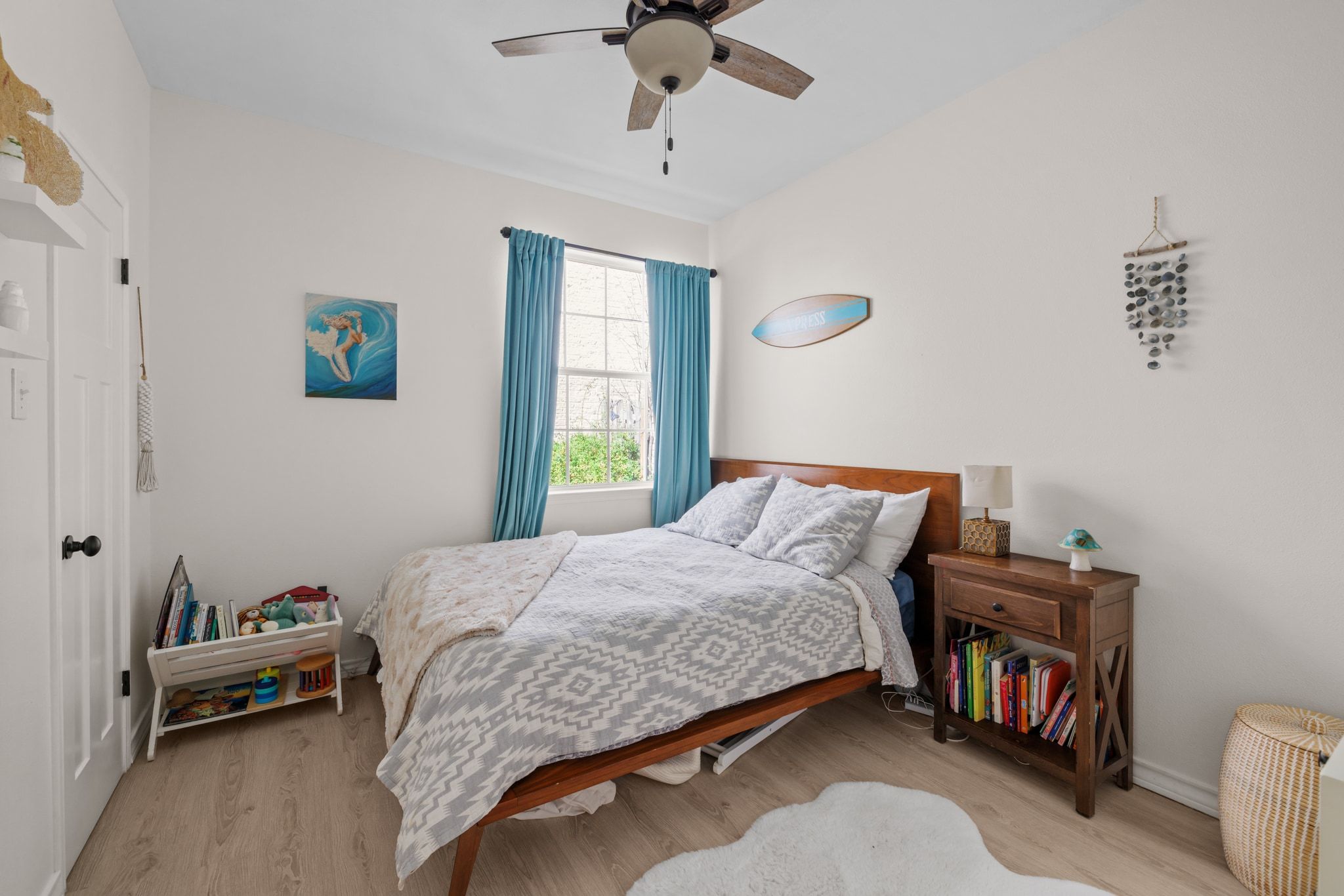 208 Sailors Run Lakeway, TX 78734 - Photo 17 of 40 The third bedroom is well-sized with a ceiling fan and a walk-in closet.