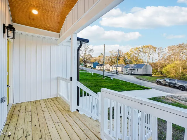 a view of a porch with wooden floor