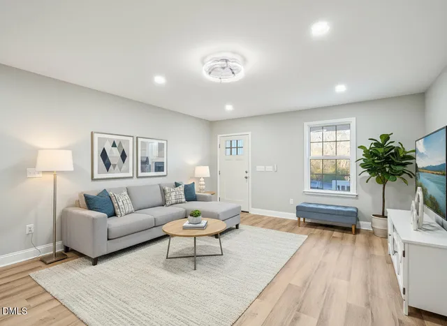 a living room with furniture and a large window