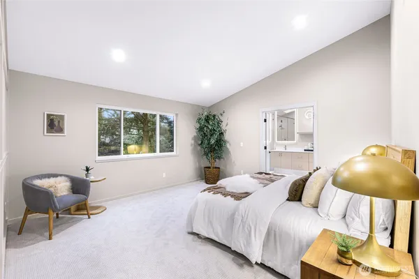 a bedroom with a bed chair and window