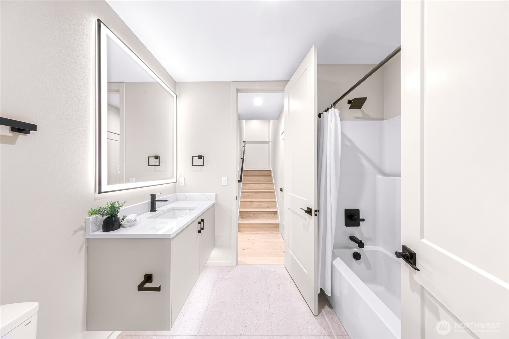 404 Willow Rd Place Bellingham, WA 98225 - Photo 35 of 40 a bathroom with a tub sink and mirror