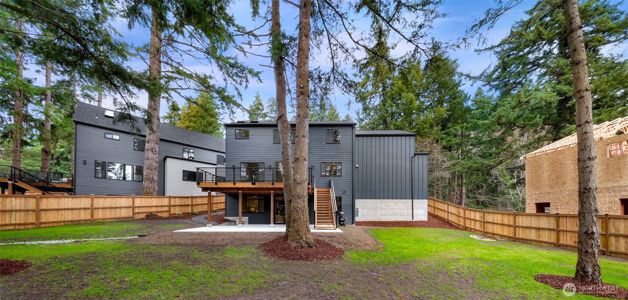 404 Willow Rd Place Bellingham, WA 98225 - Photo 39 of 40 a view of a house with a yard and a large tree