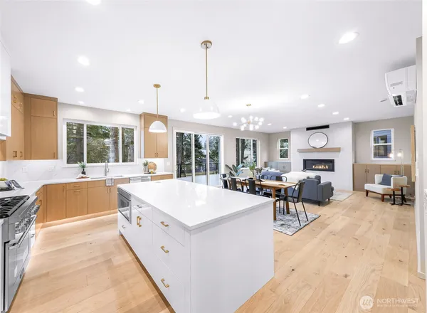 a large kitchen with lots of counter top space and stainless steel appliances