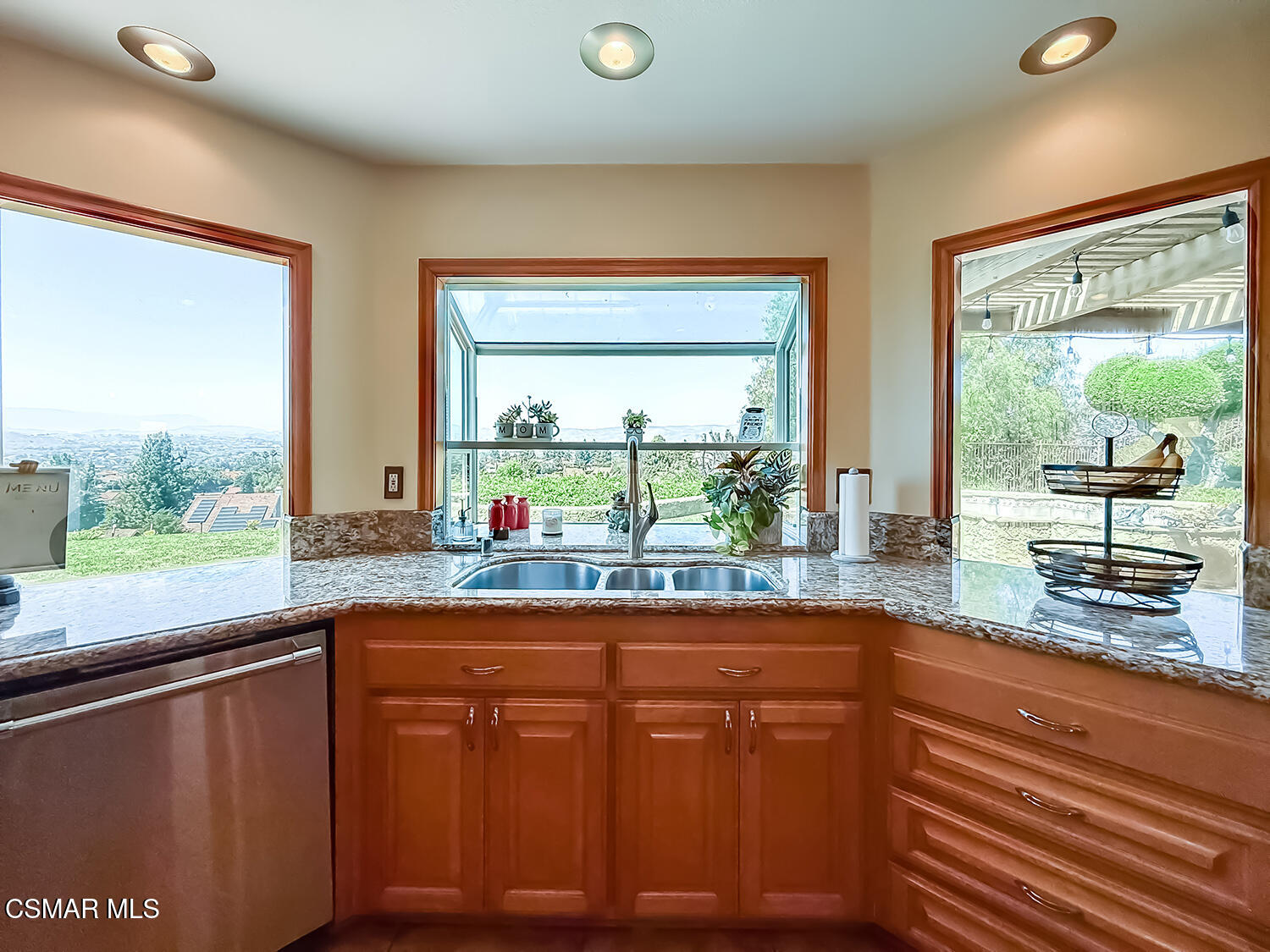 13749 Gunsmoke Road Moorpark, CA 93021 - Photo 24 of 61 a kitchen with large window sink and cabinets