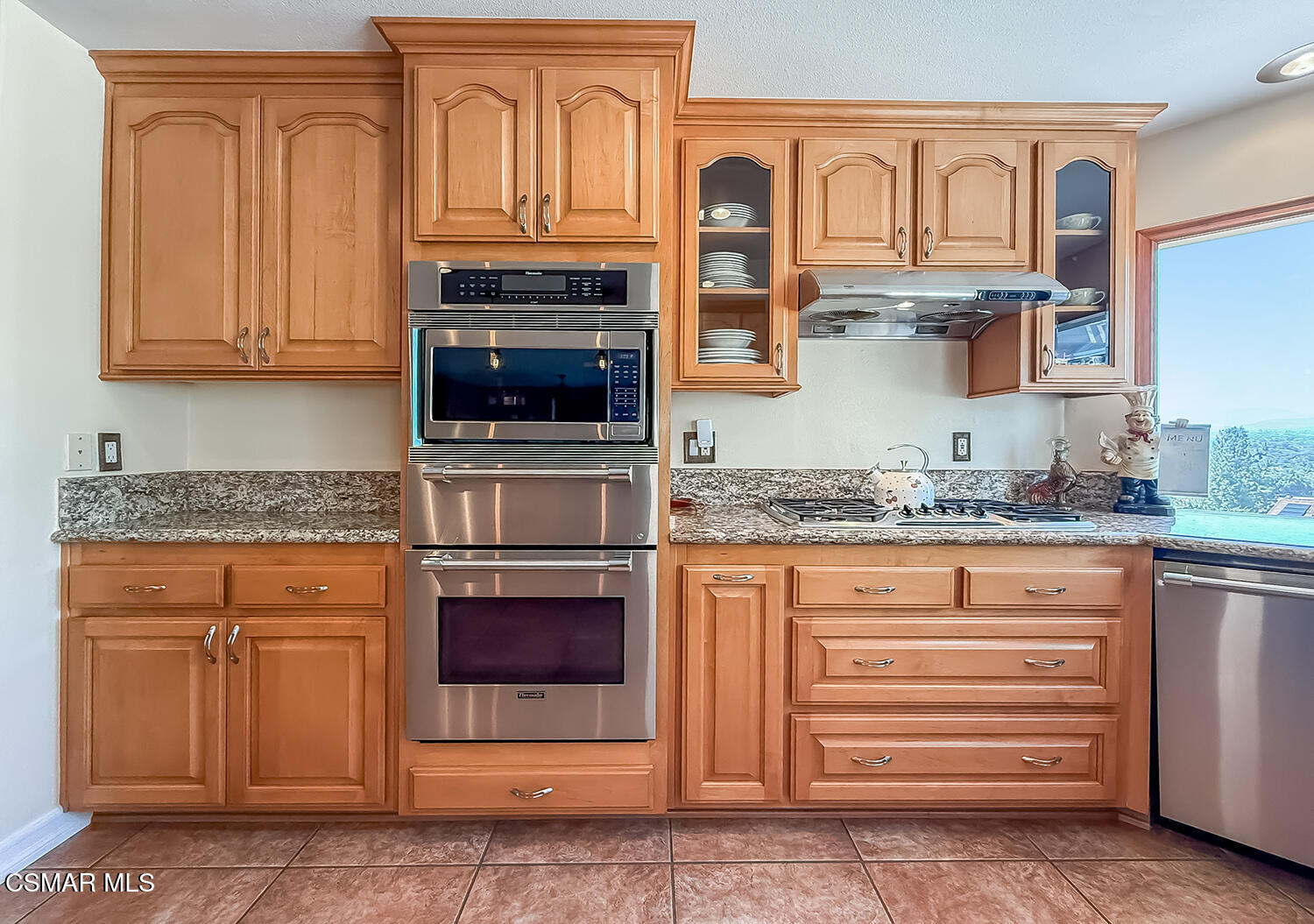 13749 Gunsmoke Road Moorpark, CA 93021 - Photo 25 of 61 a kitchen with granite countertop stainless steel appliances granite countertop a stove a sink and a microwave