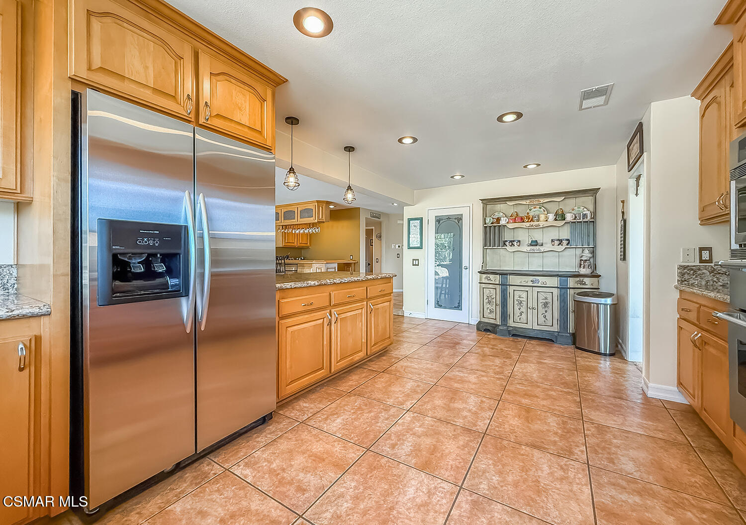 13749 Gunsmoke Road Moorpark, CA 93021 - Photo 28 of 61 a kitchen with stainless steel appliances granite countertop a refrigerator and a sink