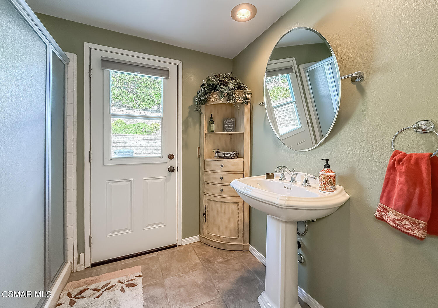 13749 Gunsmoke Road Moorpark, CA 93021 - Photo 31 of 61 a bathroom with a sink and a mirror