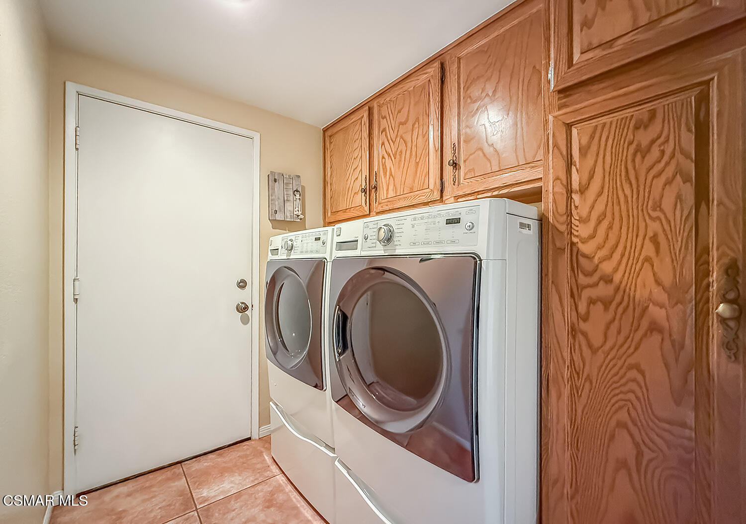 13749 Gunsmoke Road Moorpark, CA 93021 - Photo 34 of 61 a utility room with dryer and washer