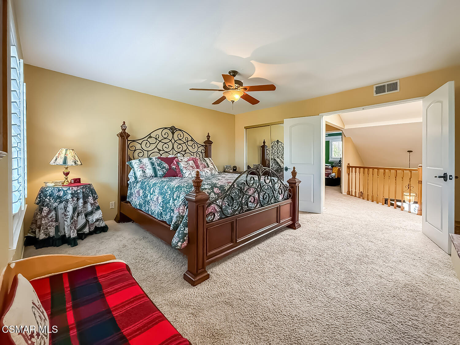 13749 Gunsmoke Road Moorpark, CA 93021 - Photo 45 of 61 a bedroom with a bed and a chandelier